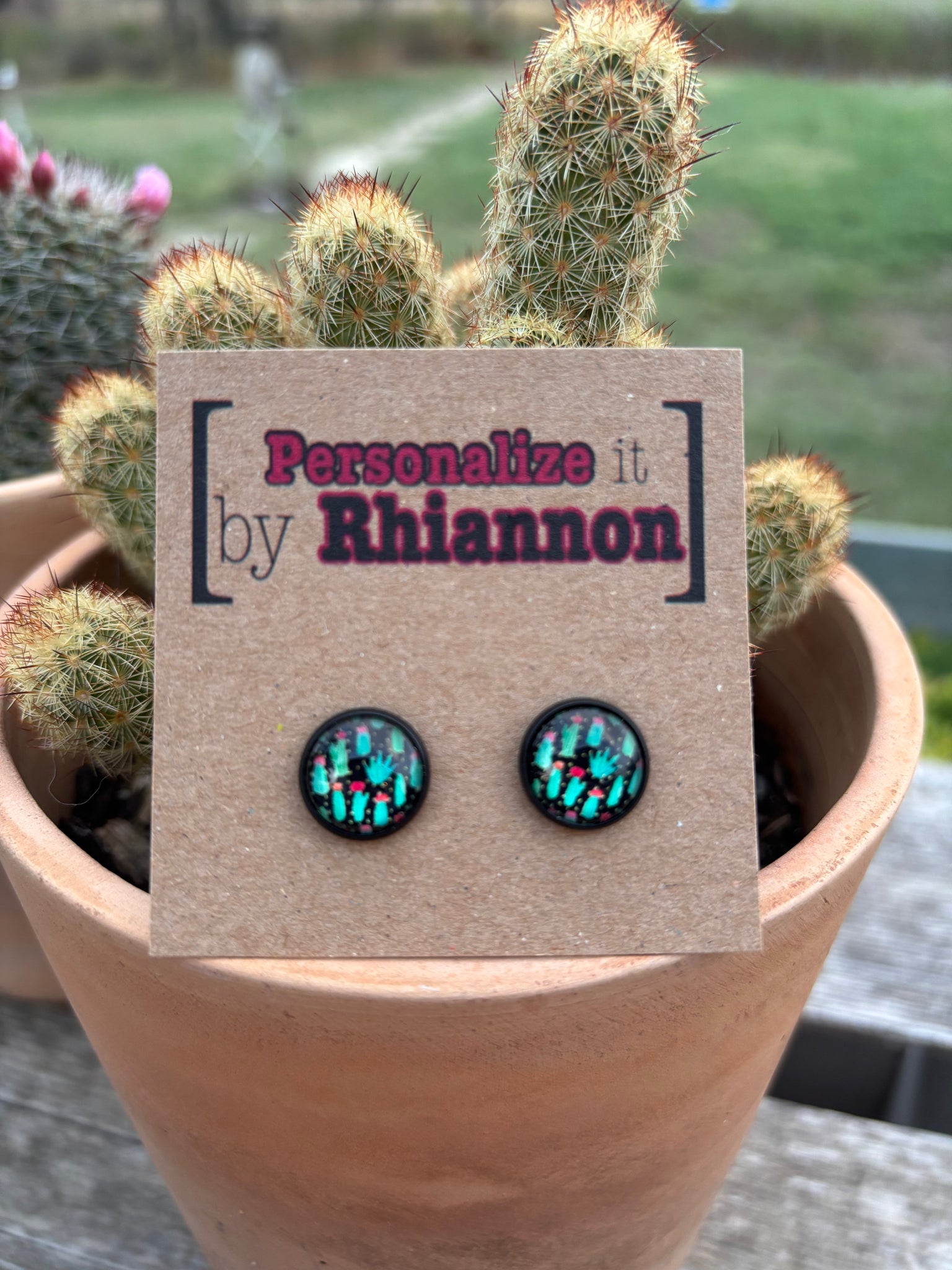 Black cactus stud earrings